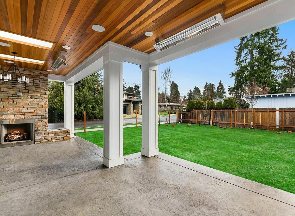 Infrared Ceiling Heaters and a Stone Fireplace Make This Patio a Year-Round Room