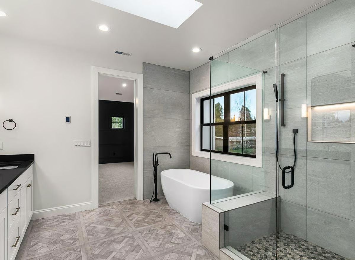 Skylit Primary Bath Pairs a Soaking Tub with a Walk-In Shower Built for Two