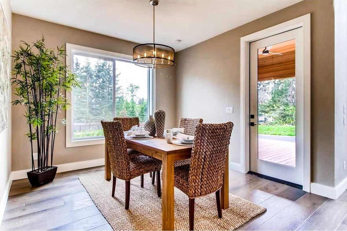 Wicker Chairs and a Glass Door That Makes Dinner Feel Alfresco