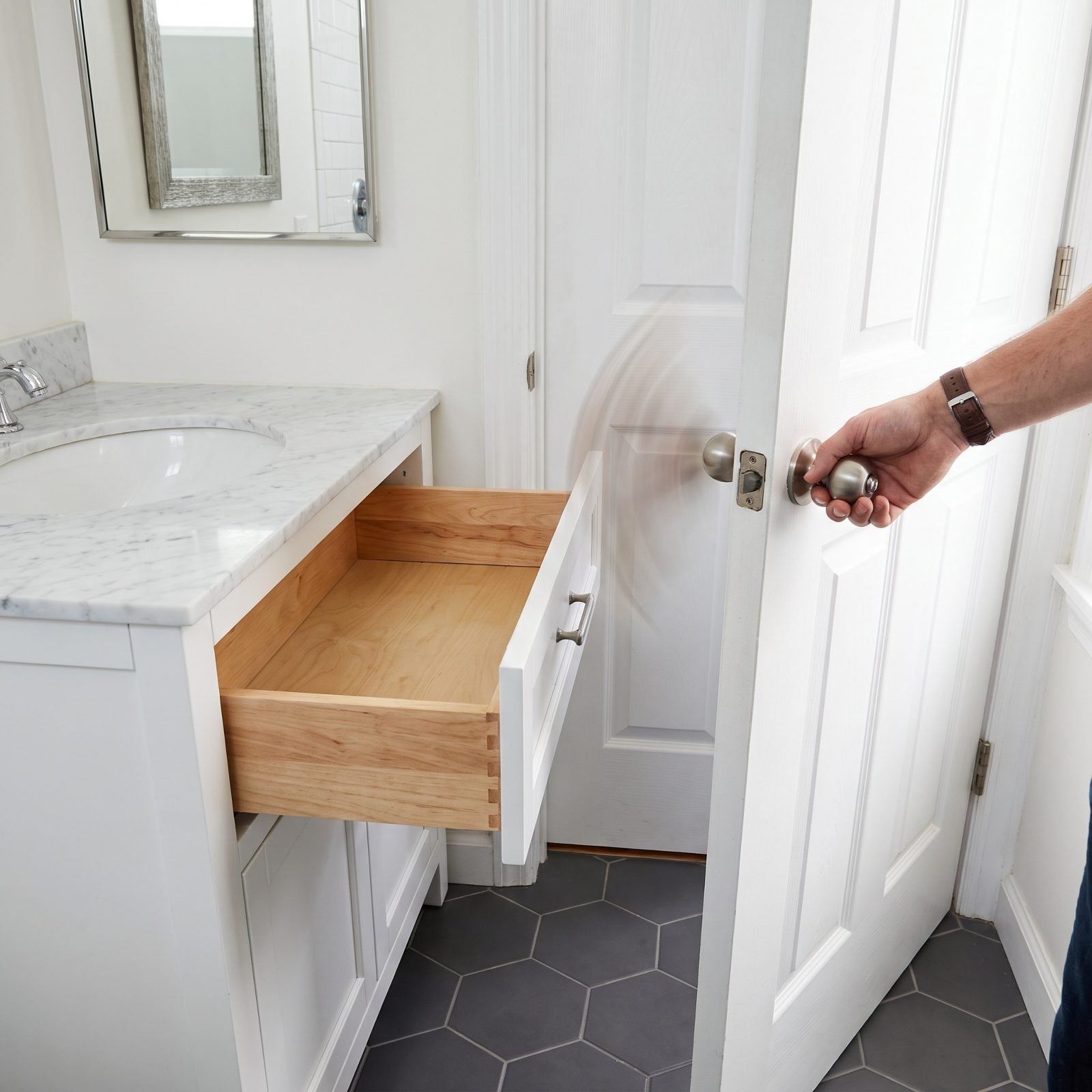 A Bathroom Door That Swings Into the Vanity and Blocks Its Drawers