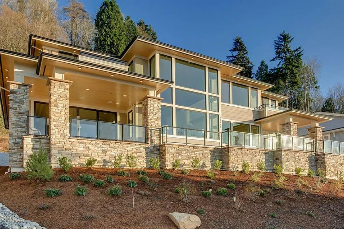 Stone Columns, Glass Walls, and a Hillside That Does All the Work