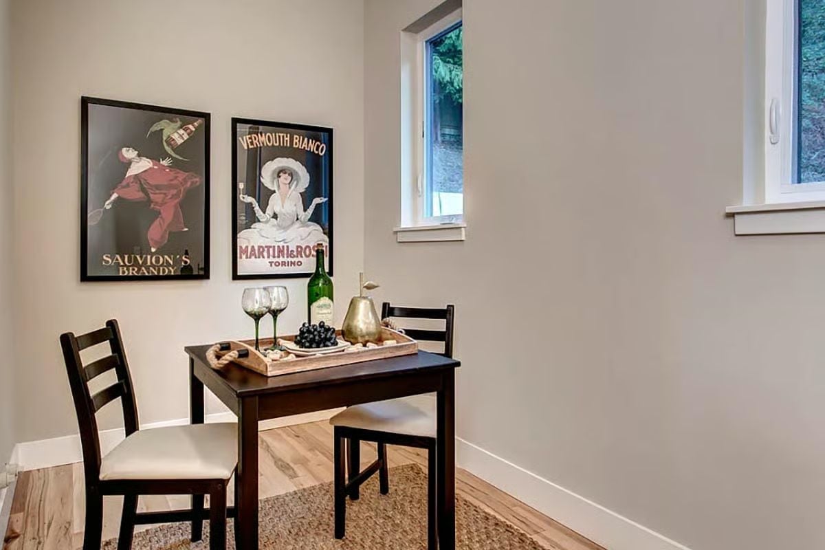 Vintage Brandy Posters and a Two-Seat Table Built for Slow Afternoons