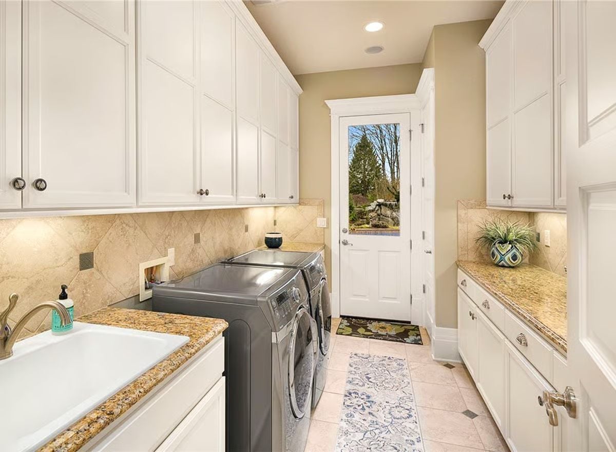 Granite Counters, Marble Tile, and a Laundry Room That Finally Has Enough Cabinet Space