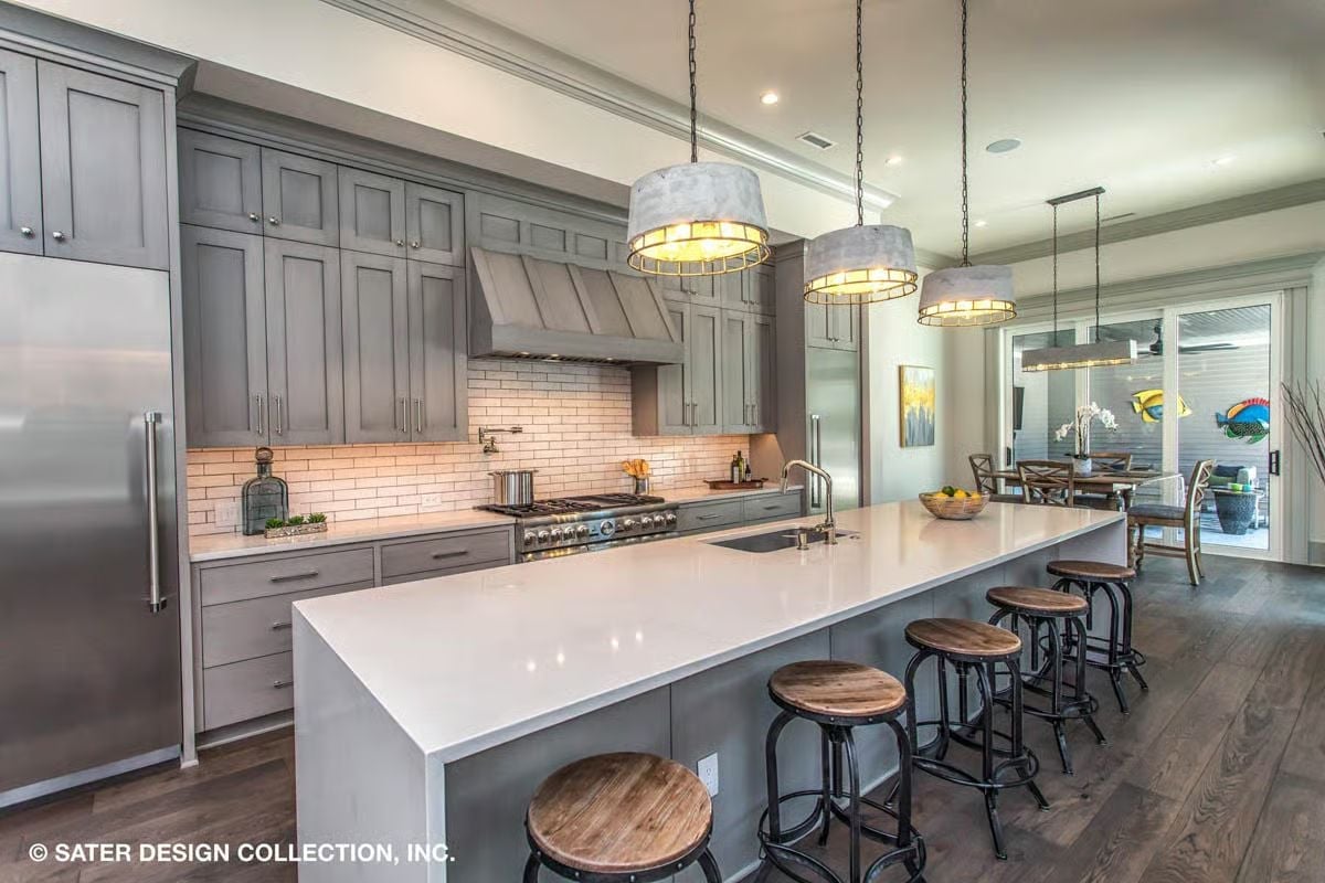 Gray Cabinetry and a Waterfall Island That Anchor a Working Kitchen