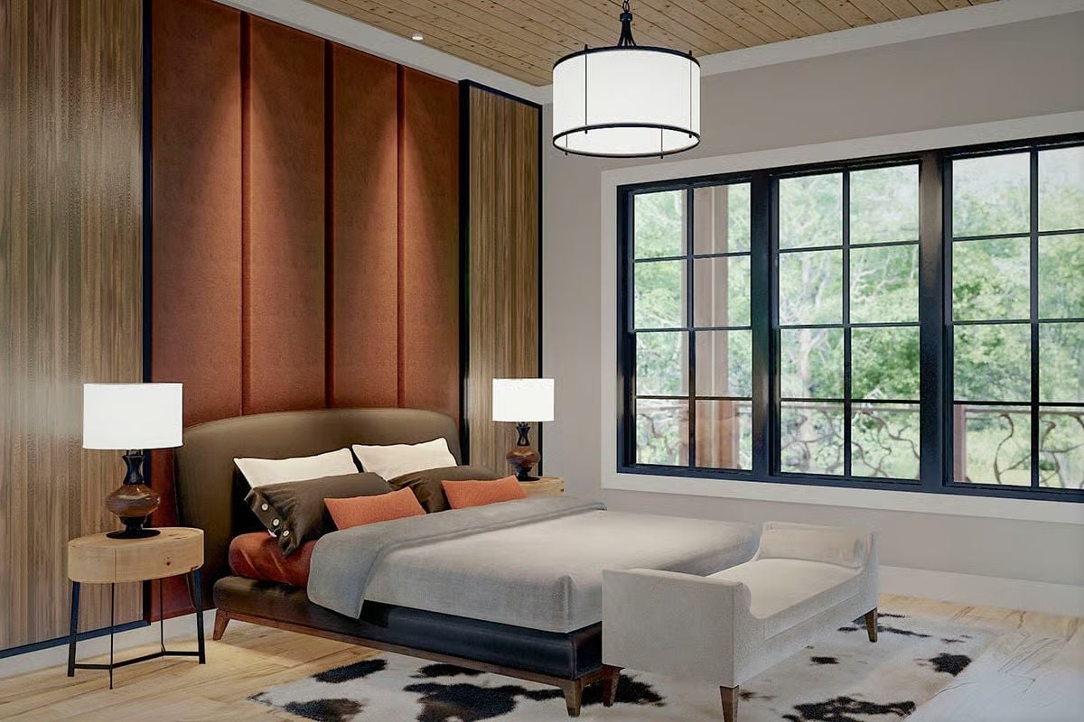 Rust Panels, a Cowhide Rug, and Bedside Lamps That Actually Belong Here