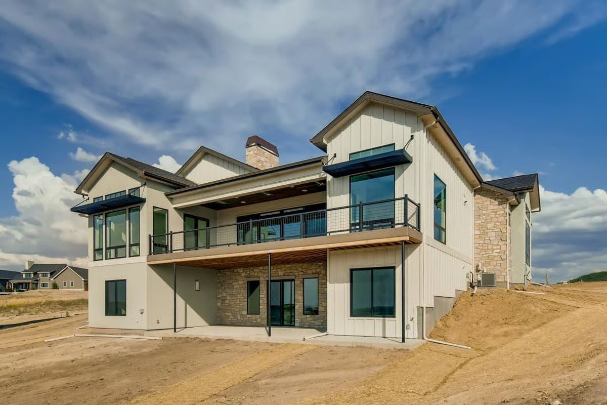Board-and-Batten, Stone Veneer, and a Balcony Rail That Earns Its Spot