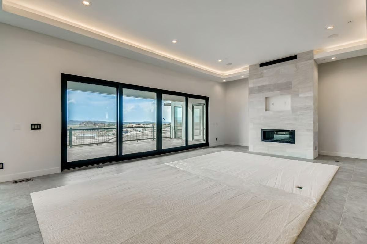 Sliding Glass, Stone Surround, and a View That Does the Decorating