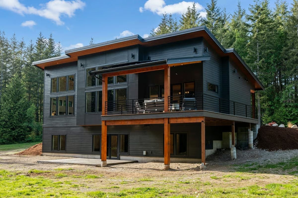 Dark Siding, Warm Timber, and a Deck That Earns Its Square Footage