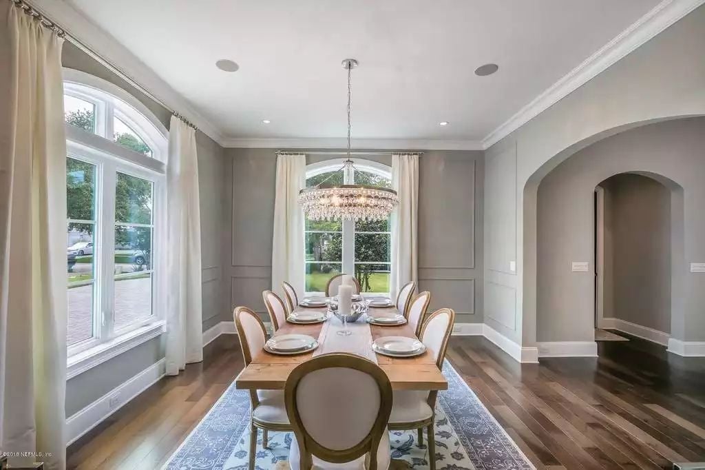 Crystal Chandelier, Wainscoting Panels, and a Table Built for Eight