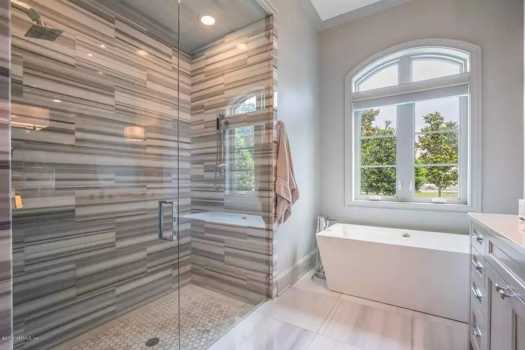 Horizontal Stone Tile and a Freestanding Tub That Earns Every Square Foot