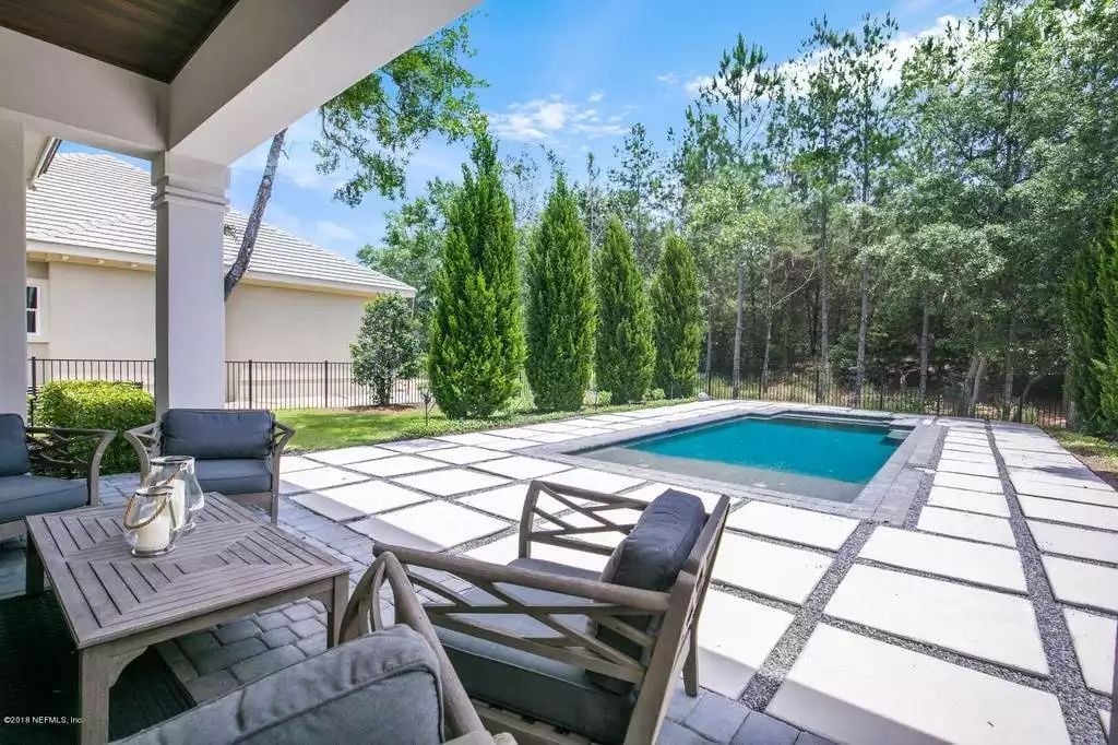 Oversized Pavers, a Rectangular Pool, and Enough Seating to Actually Use the Yard