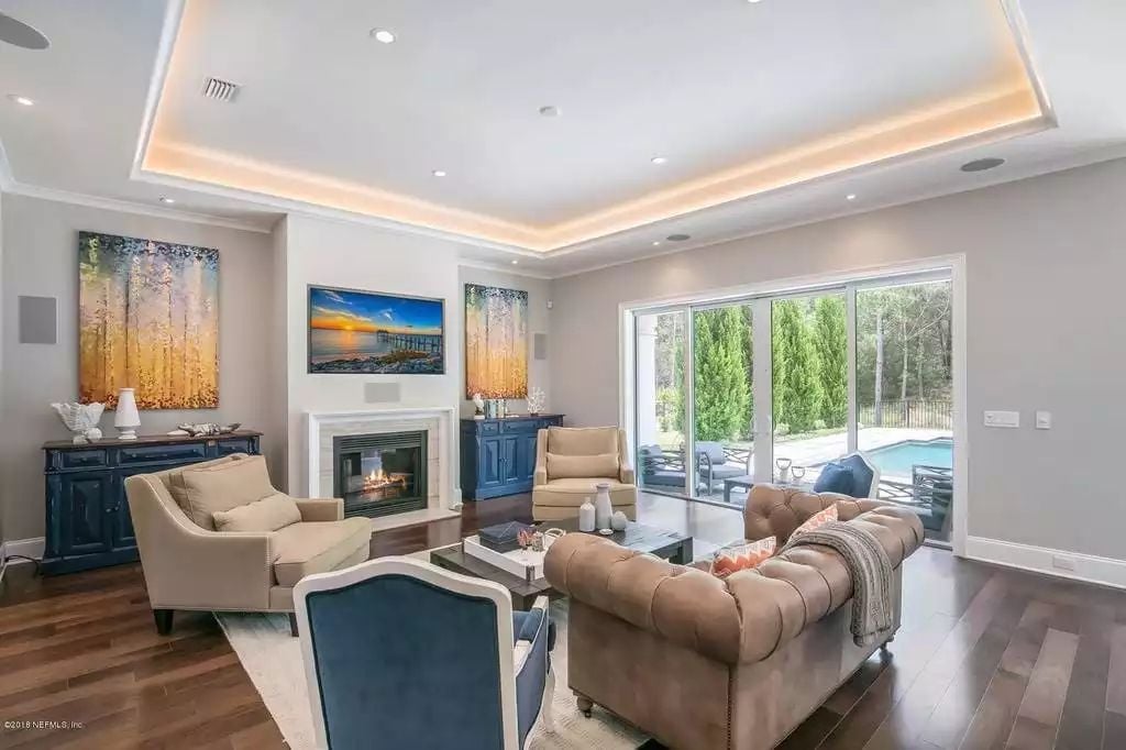 Tray Ceiling, Tufted Leather, and a Fireplace That Actually Gets Used