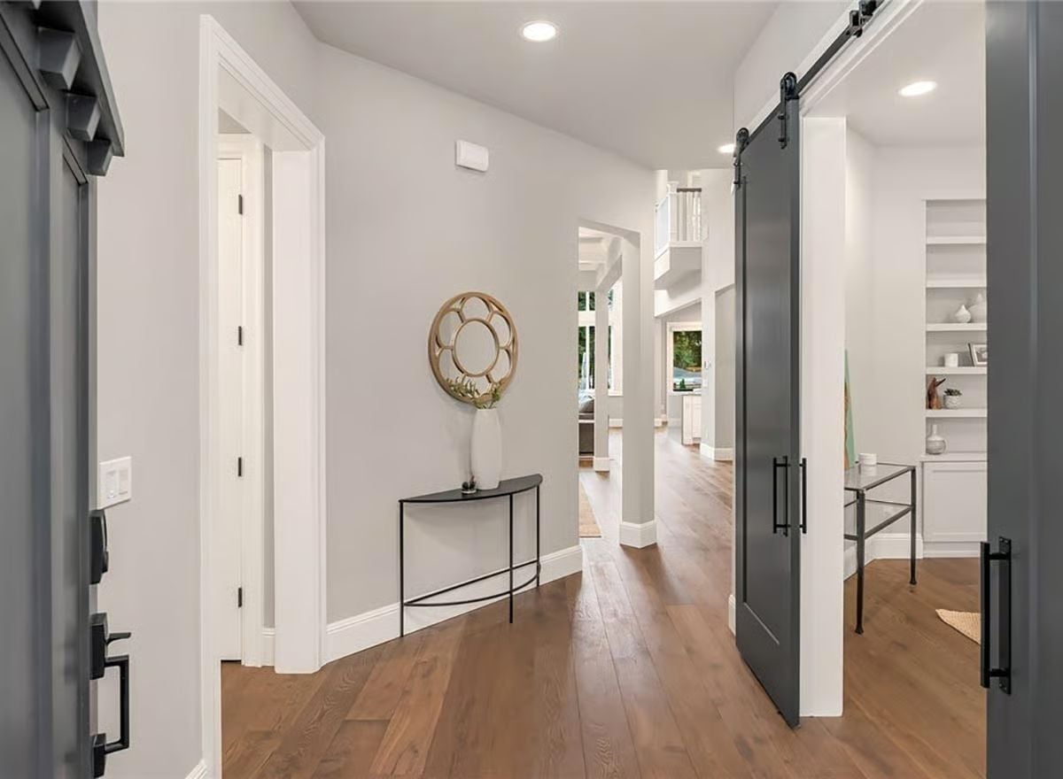 Barn Door, Hardwood Floors, and a Mirror That Earns Its Wall Space