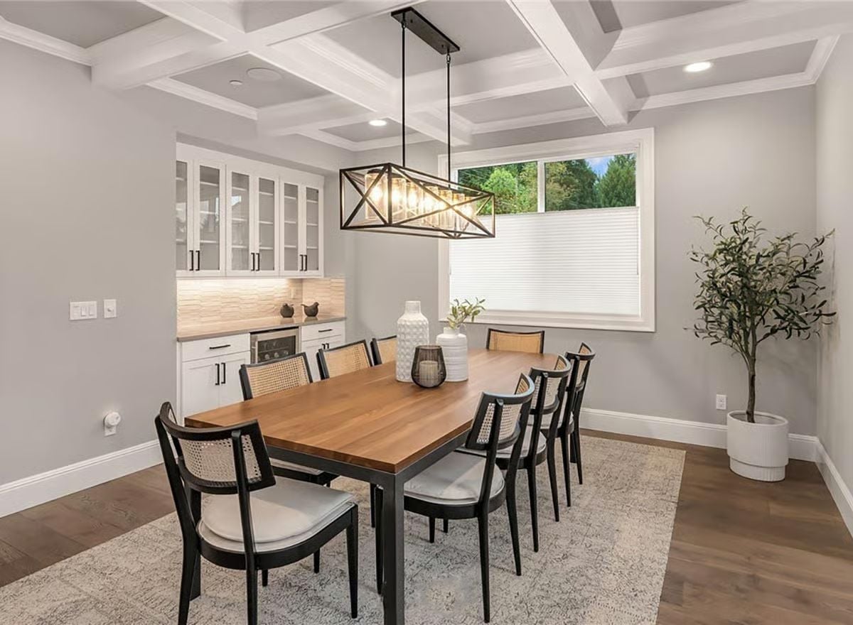 Coffered Ceiling, Cane Chairs, and a Wet Bar That Knows Its Place