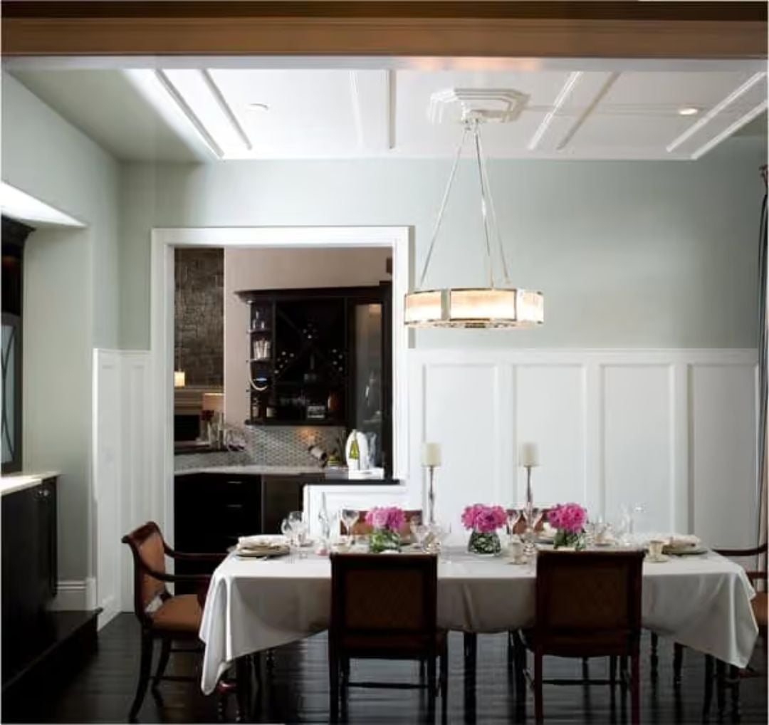 Coffered Ceilings and Candlelit Pink Florals Set the Tone for Formal Dining Done Right