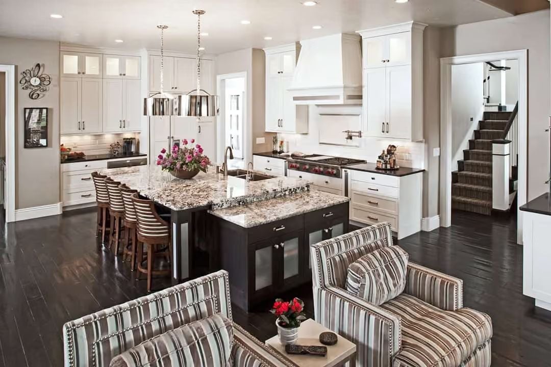 Granite Islands and Dark-Base Cabinetry Define a Kitchen Built for Real Cooking