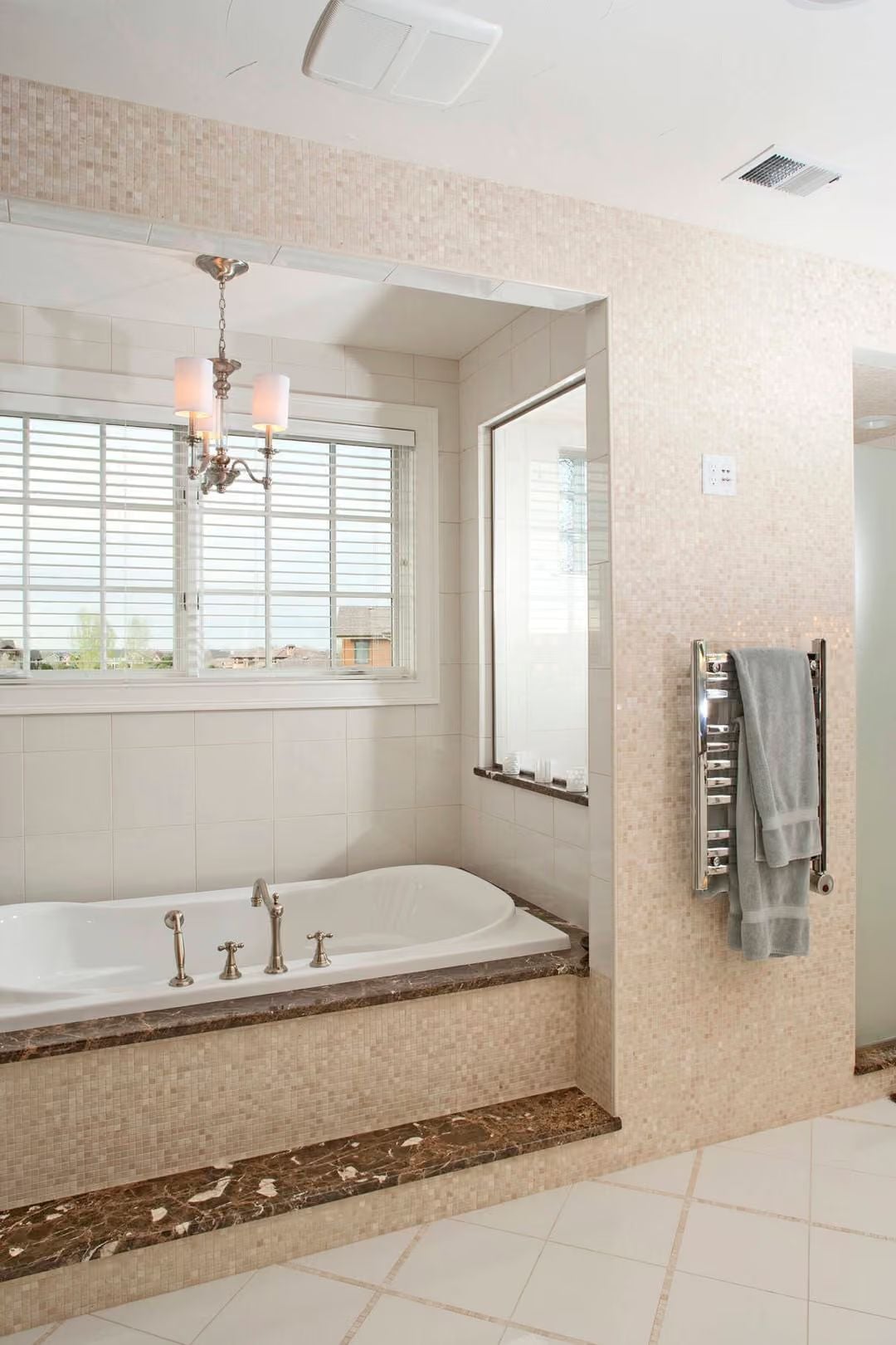 Heated Towel Rail and Mosaic Surround Make the Soaking Tub Worth Every Square Foot
