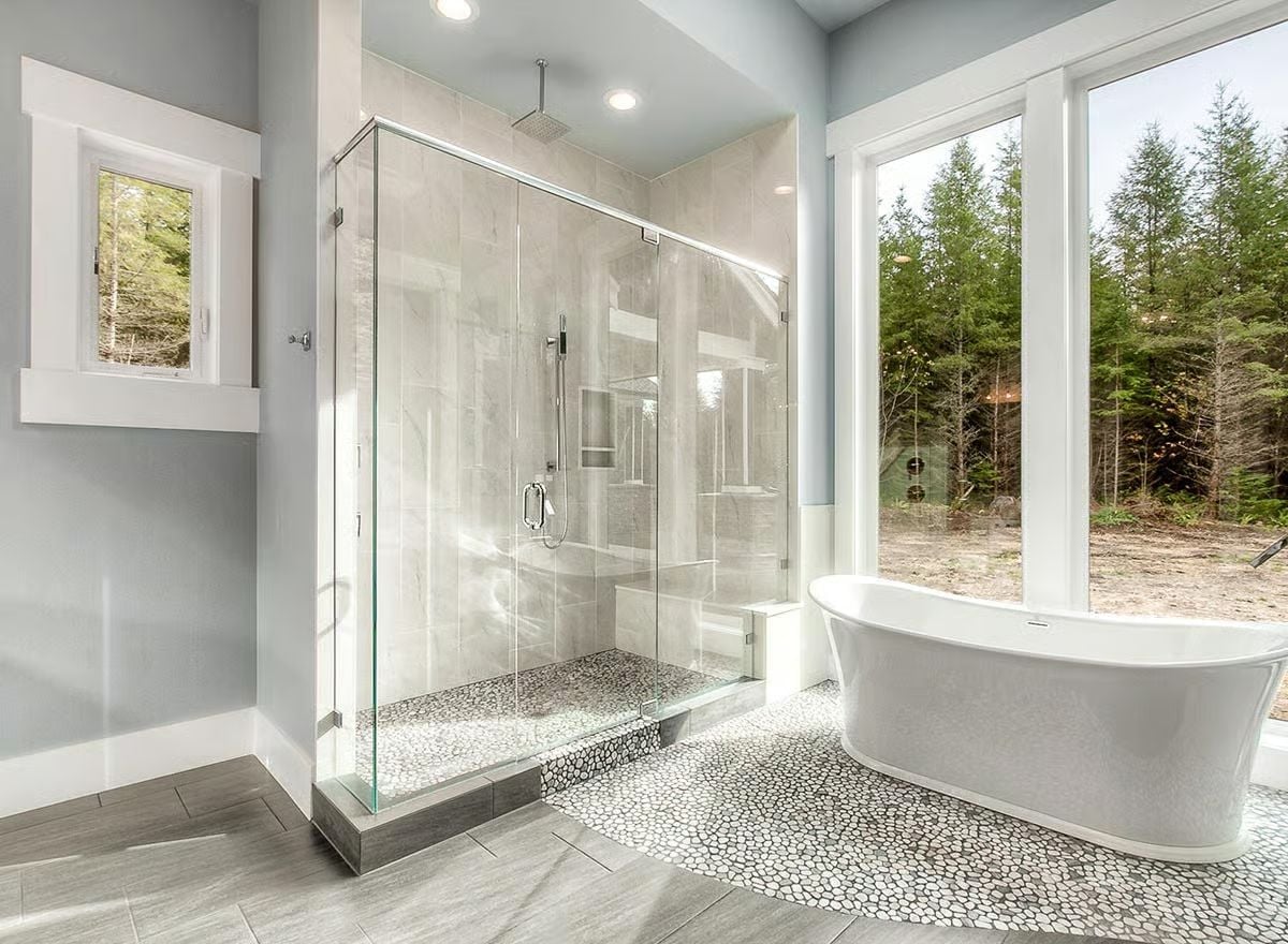 Pebble Floor Inlay and Ceiling Rain Head Turn This Shower Into a Spa Moment