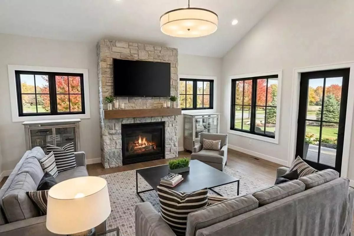 Stone Fireplace, Wood Mantel, and Gray Sofas Built for a Long Saturday