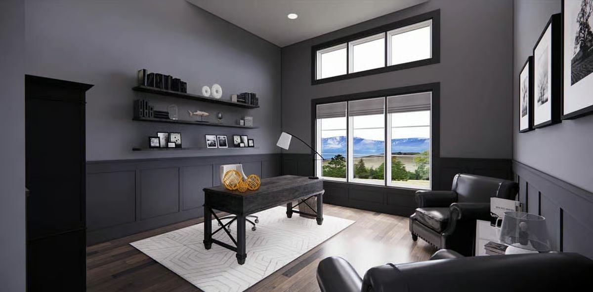 Charcoal Walls, Leather Chairs, and a View Worth Facing Your Desk Away From