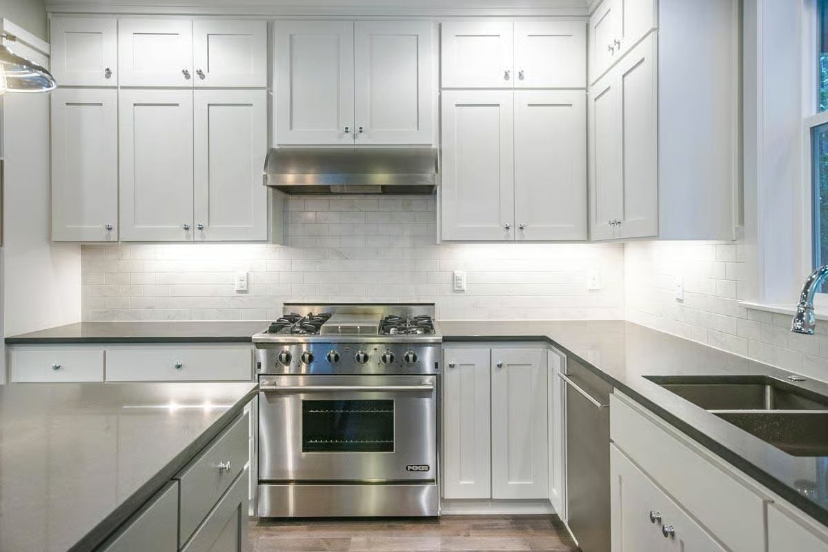 Stainless Pro Range in a White Kitchen That Doesn't Try Too Hard