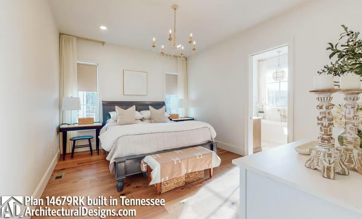 Gold Chandelier and Dark Wood Bed Frame Pull the Warmth Up from the Floor