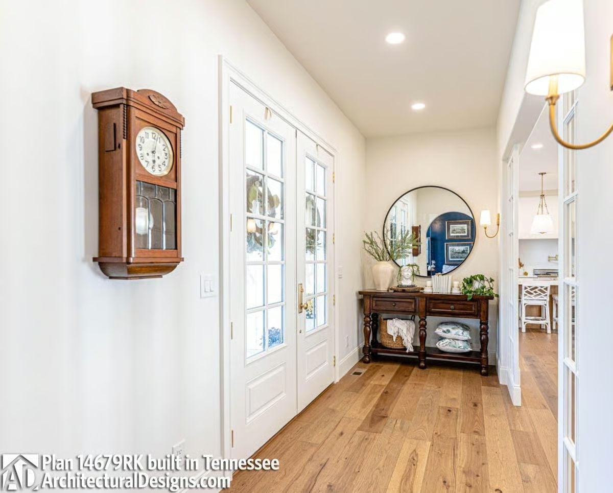 Wall Clock and French Doors Set the Tone Before You've Taken a Step Inside