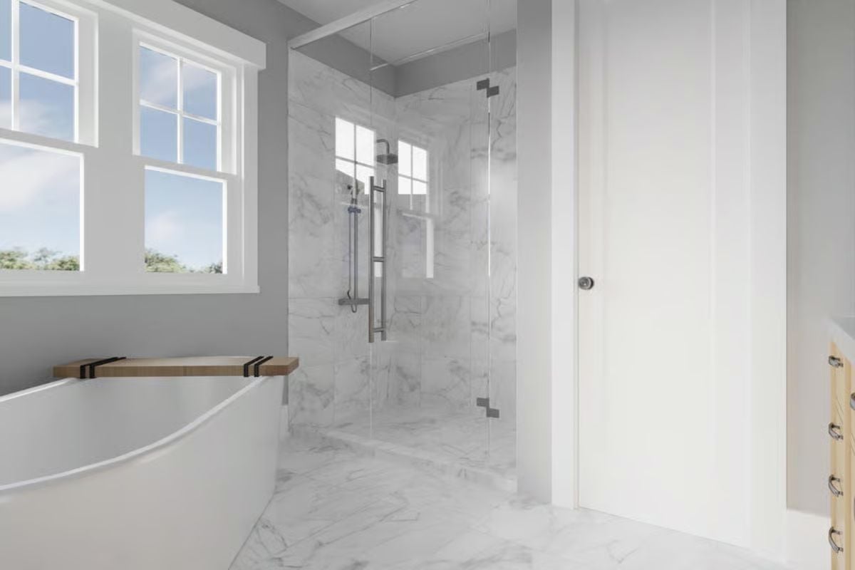 Marble Tile, a Frameless Shower, and a Soaking Tub That Doesn't Apologize for the Space It Takes