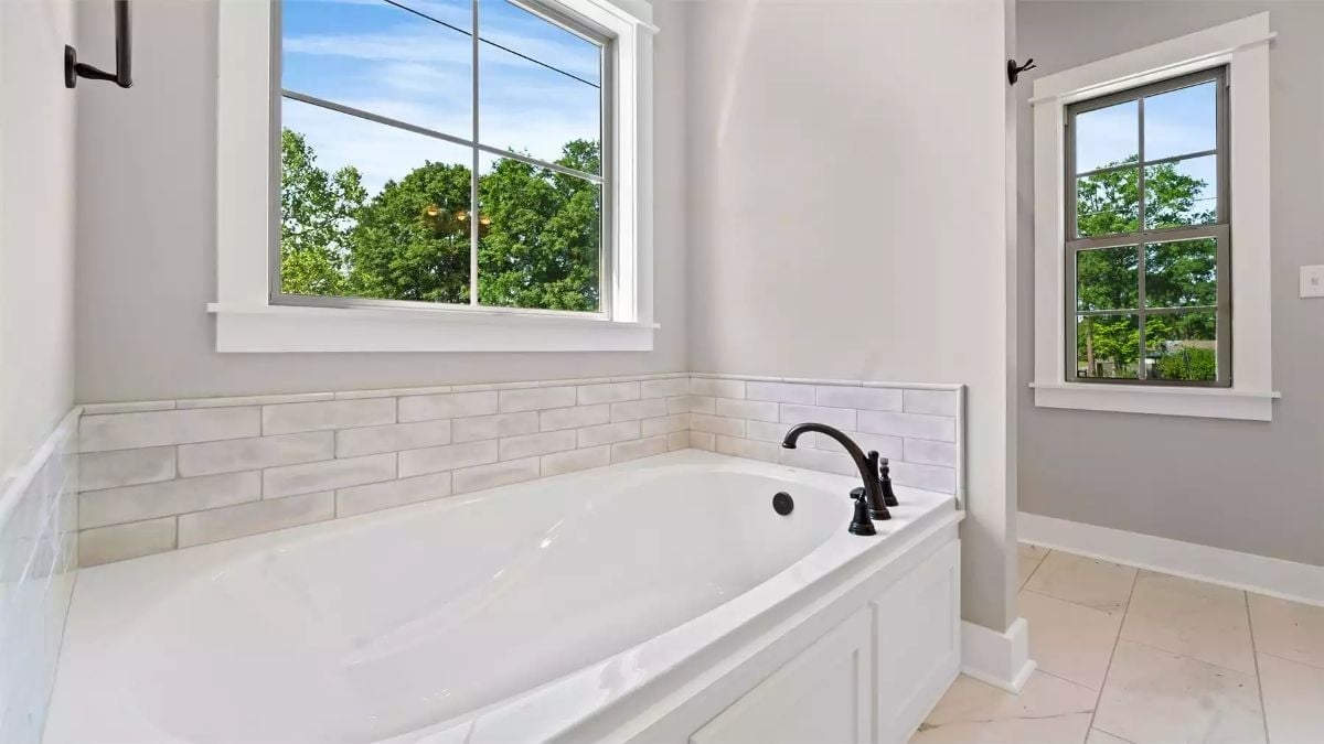 Dark Bronze Faucet, Subway Tile, and a View That Does the Decorating