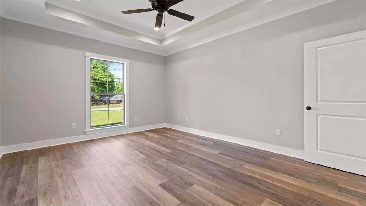 Tray Ceiling, Wood Floor, and a Window That Earns Its Keep