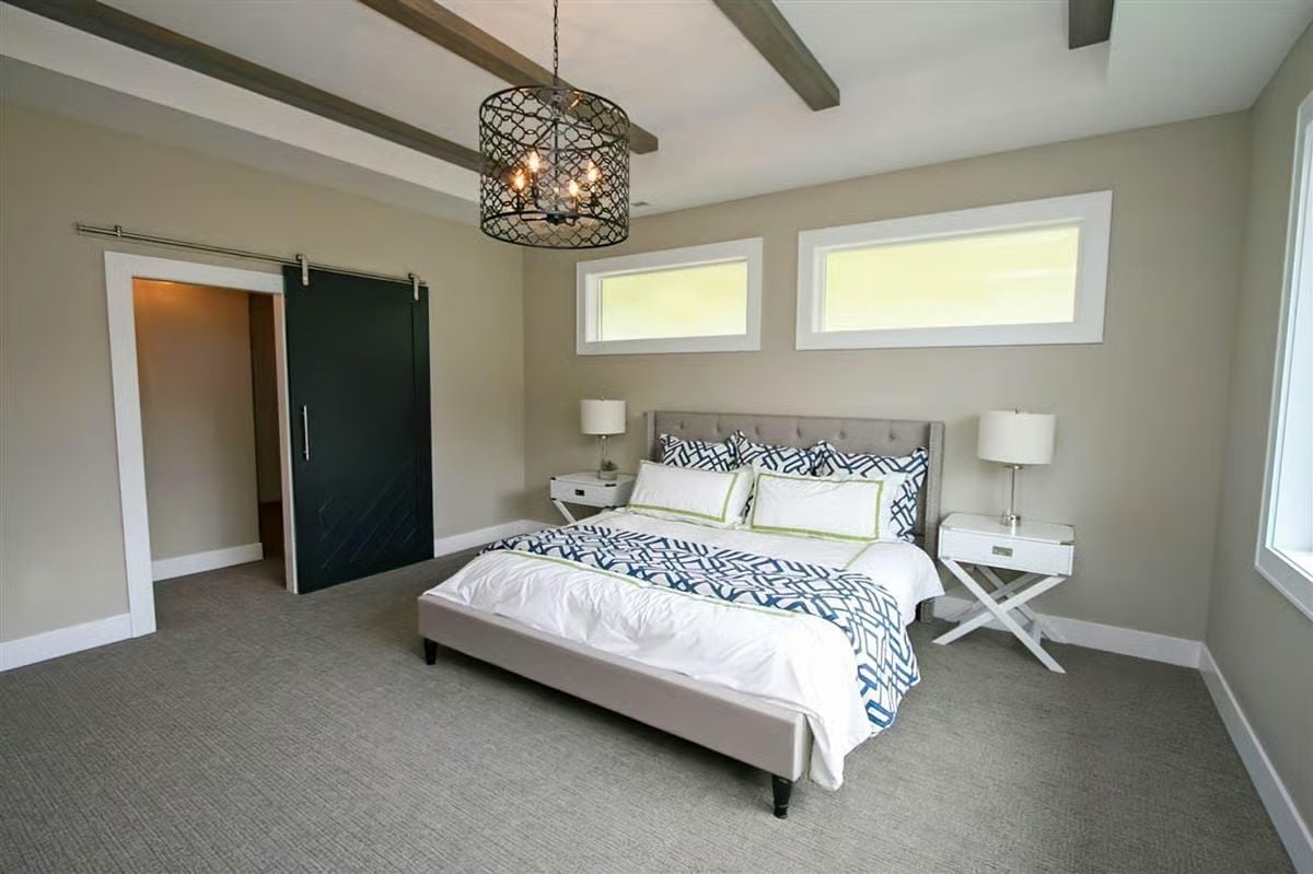 Barn Door, Exposed Beams, and a Chandelier That Refuses to Pick a Lane