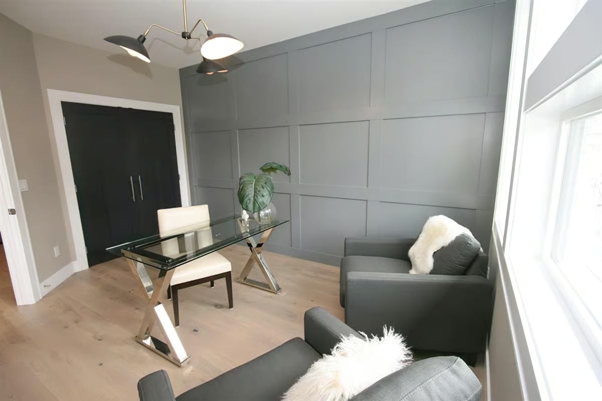 Grid-Paneled Accent Wall Anchors a Room That Knows Exactly What It's Doing