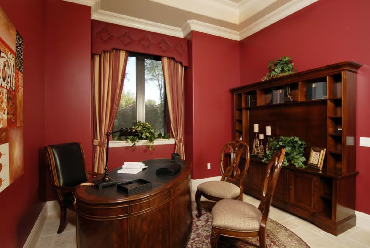 Crimson Walls and Dark Walnut Make This Home Office Mean Business