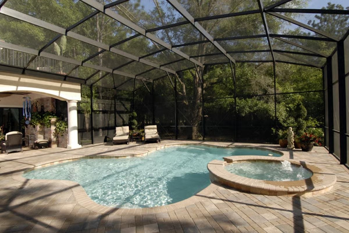 Screened Lanai With a Freeform Pool and Spa That Actually Gets Used