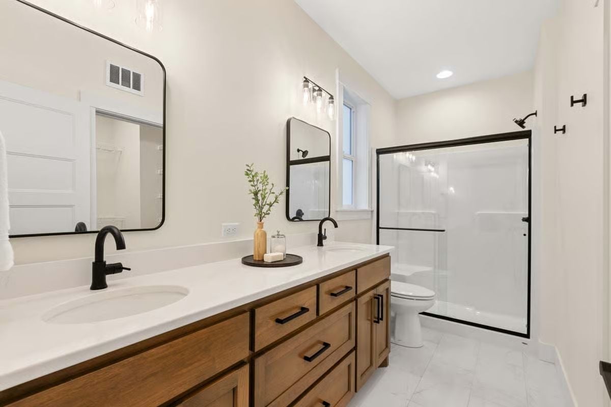 Matte Black Fixtures on a Wood Vanity That Doesn't Try Too Hard