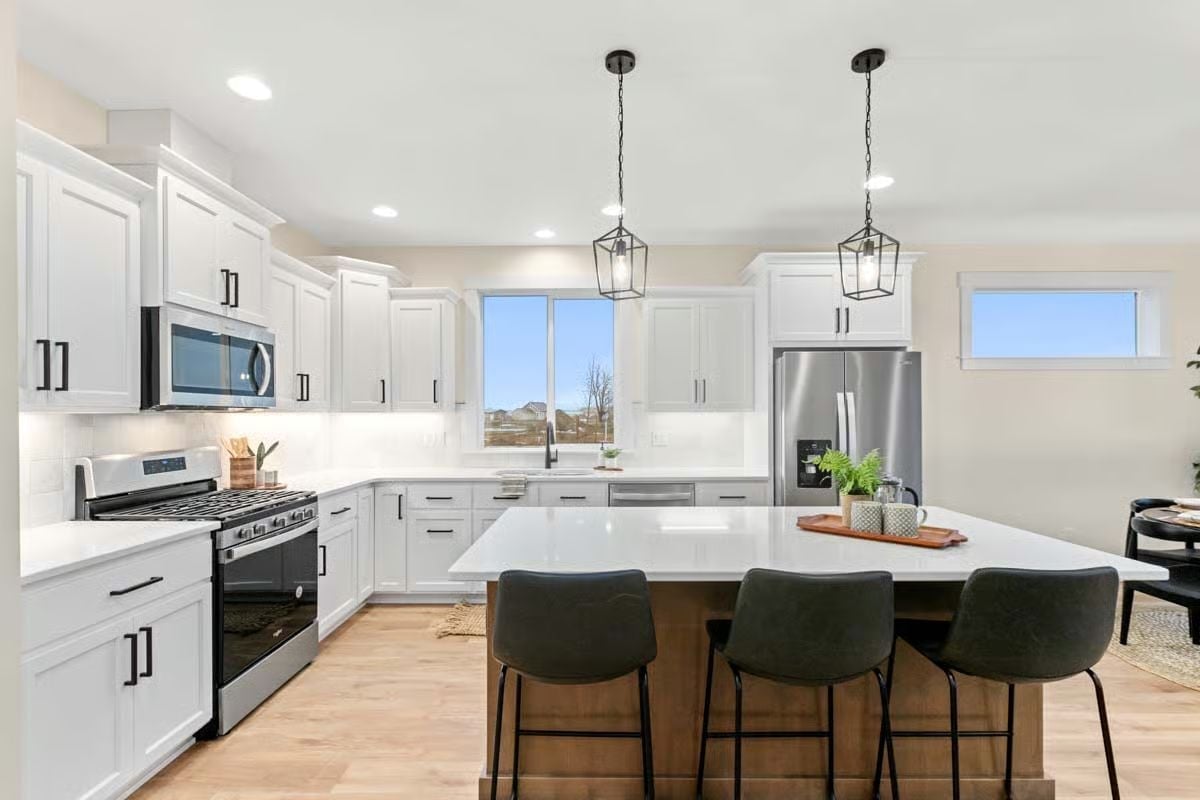 White Cabinets, Black Hardware, and an Island That Pulls Its Weight