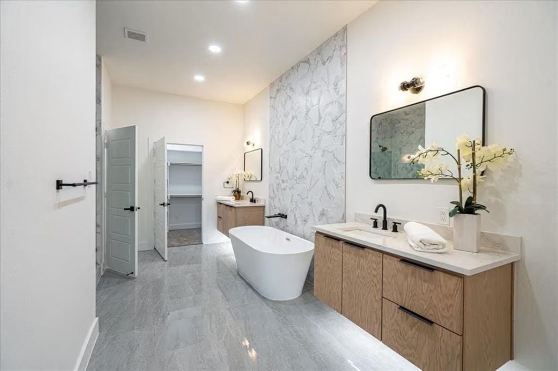 Dual Floating Vanities and a Freestanding Tub Justify Every Square Foot of This Primary Bath
