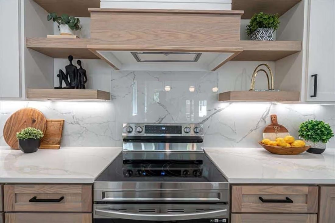 Floating Wood Shelves Flanking the Range Hood Make Open Storage Look Intentional
