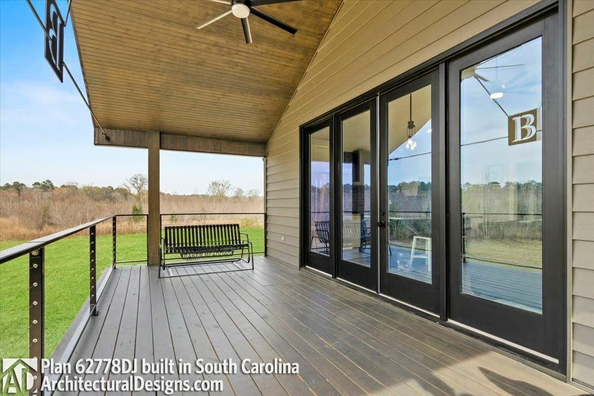 Covered Deck With French Doors and a Porch Swing Built for Doing Nothing