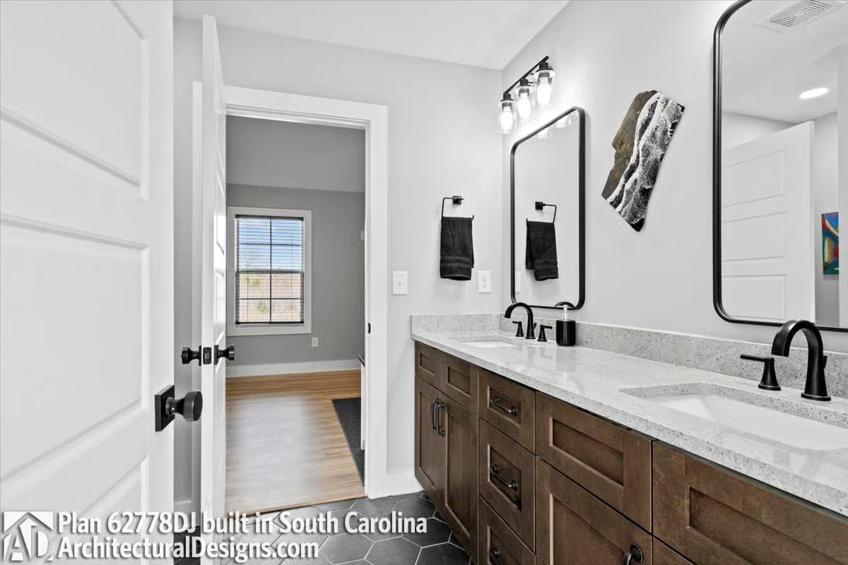 Matte Black Hardware Does the Heavy Lifting in This Double-Vanity Bathroom