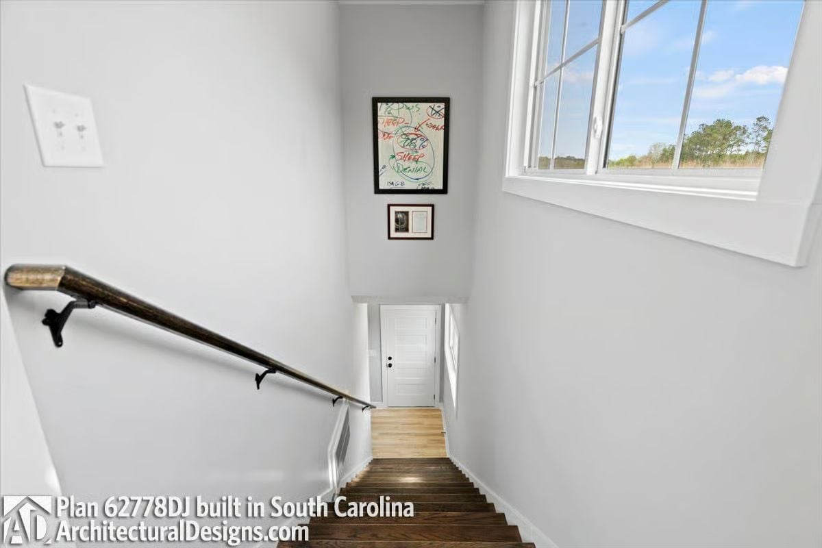 Stairwell Art Wall With a View That Earns Its Keep