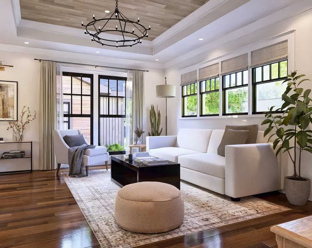Warm Wood Floors, White Sofas, and a Chandelier That Earns Its Keep