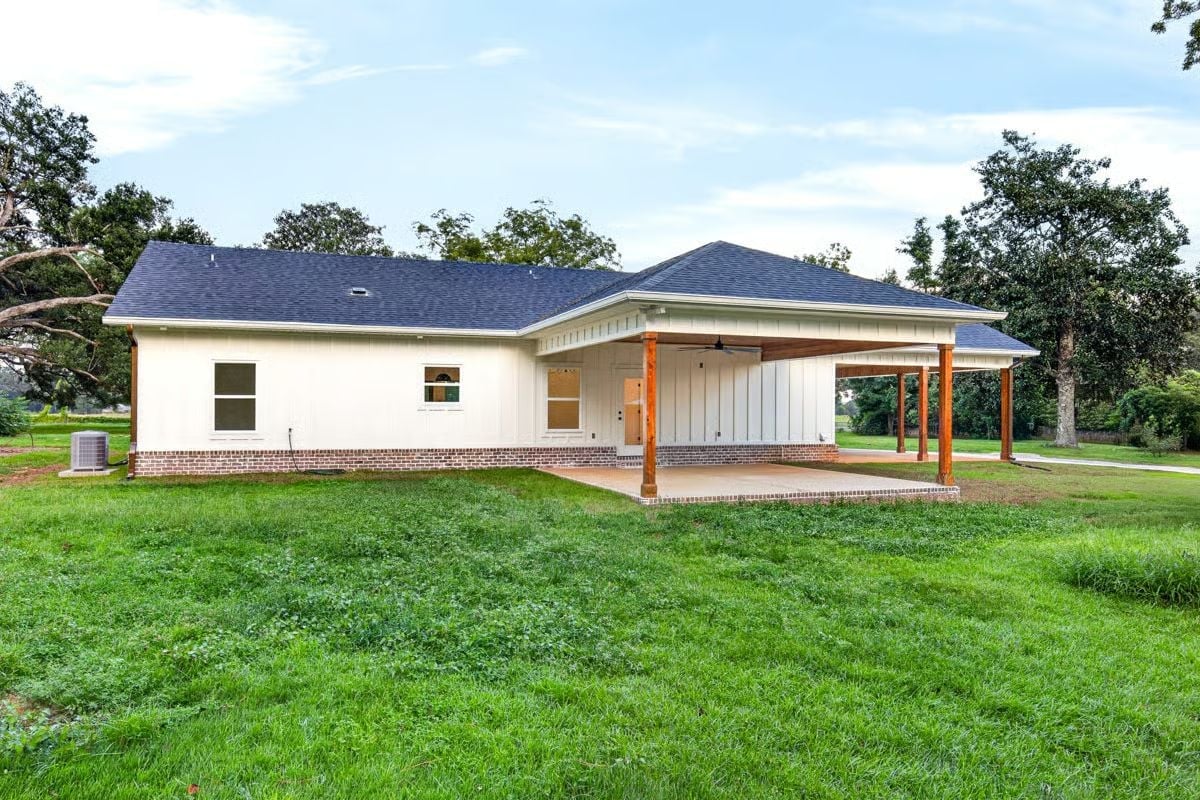 Rustic Cedar Posts Anchor a Covered Carport Built for Hot Afternoons
