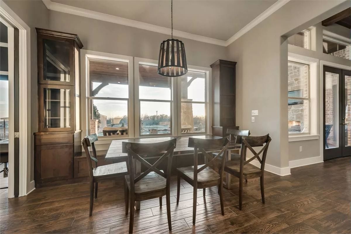 Cage Pendant and Cross-Back Chairs Built Around Natural Light