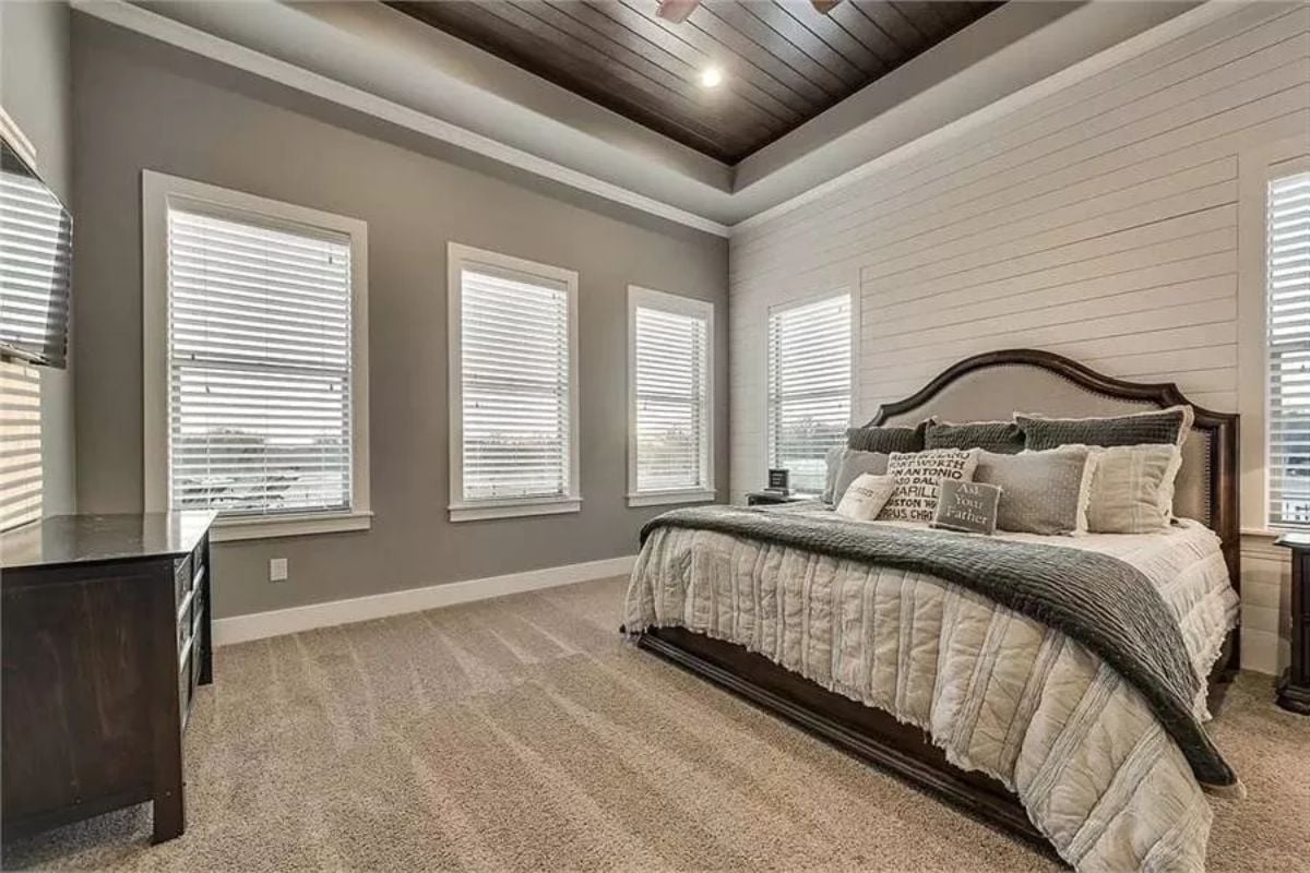 Dark Wood Headboard Against Shiplap Makes a Case for Quiet Contrast