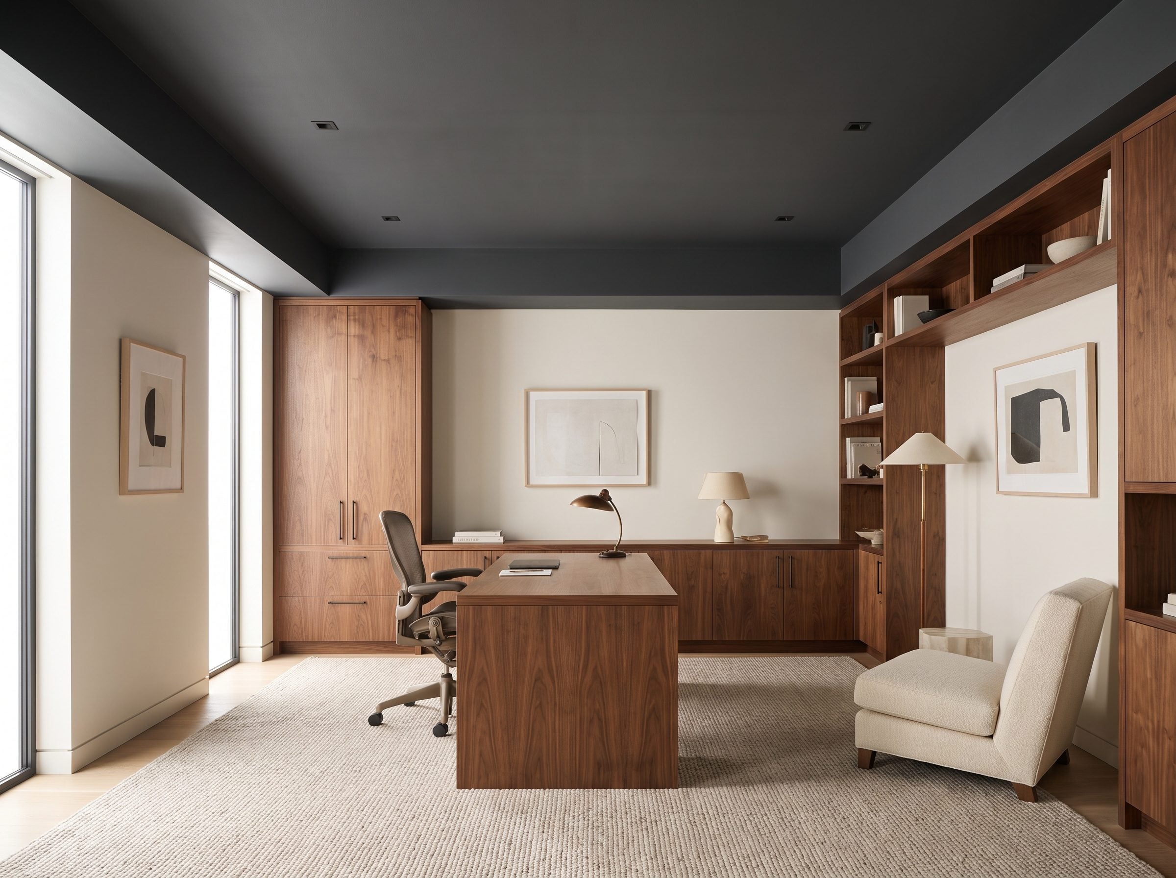 Home office with a matte charcoal ceiling filling the top third of the frame above warm off-white walls, walnut built-ins,