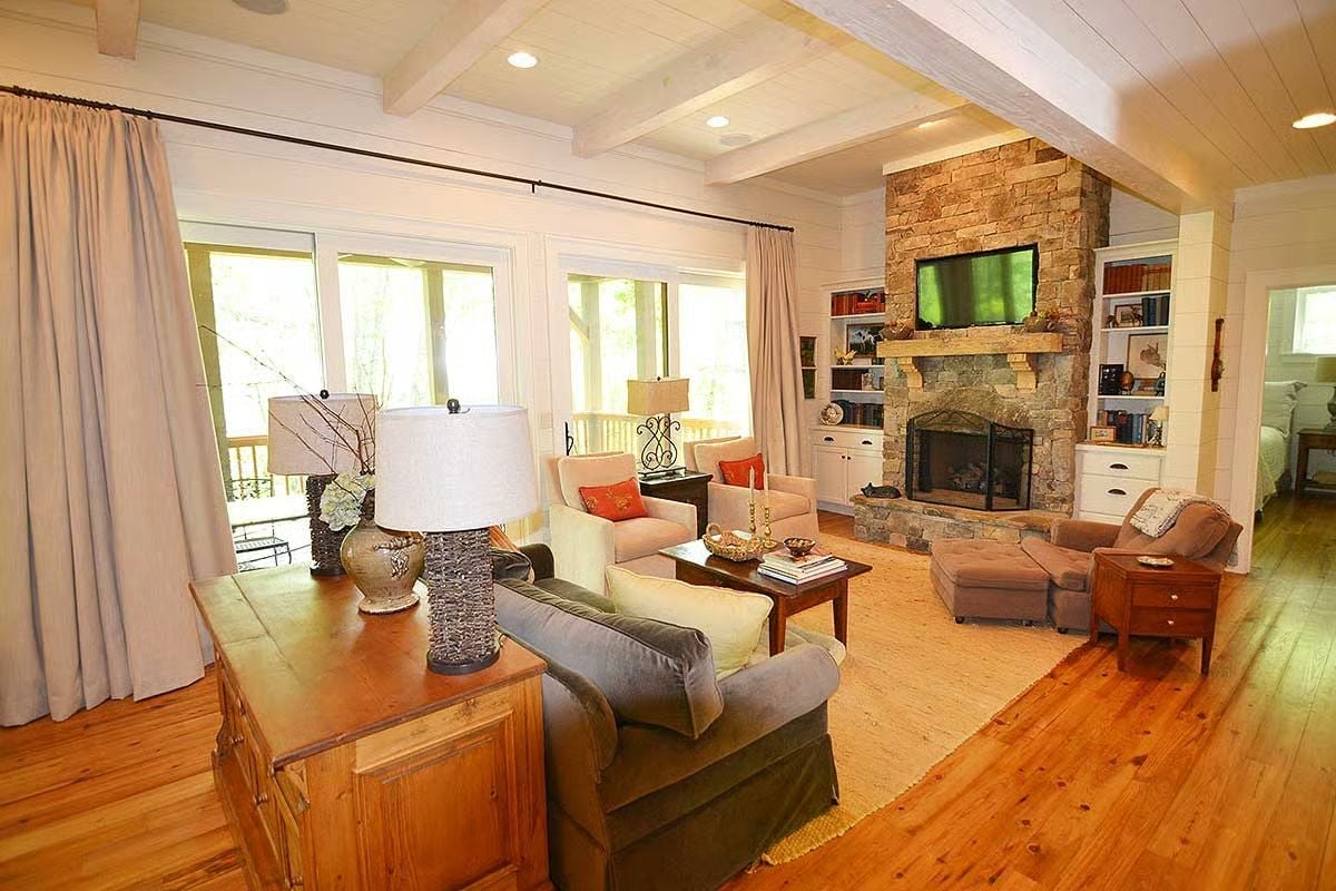 Stone Fireplace Tower Anchors a Living Room Built for Actual Gathering