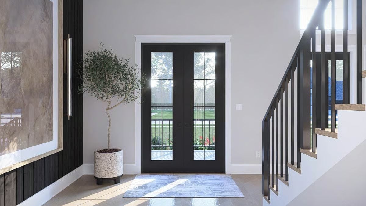 Black French Doors Doing Heavy Lifting in a Two-Story Entry