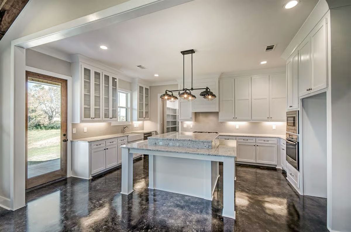 Polished Concrete and White Cabinetry Walk Into a Kitchen Together