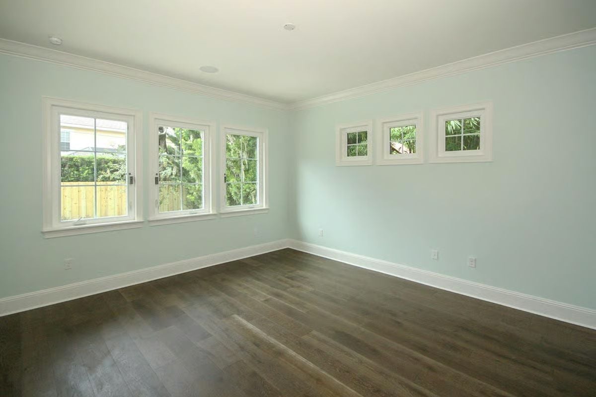 Mint Walls and Wide-Plank Floors in a Room That Hasn't Met Its Furniture Yet